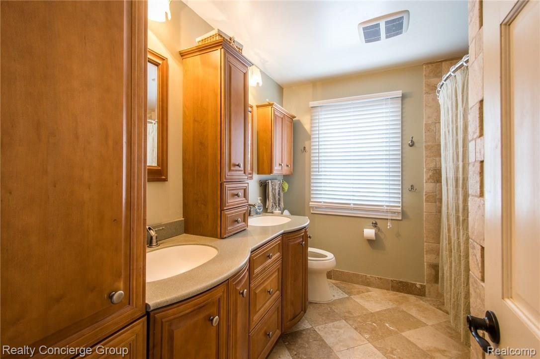 3345 South Latson Road Howell, MI 48843 - Photo 24 of 38 Completely updated Full Bathroom with Built ins and double sinks!