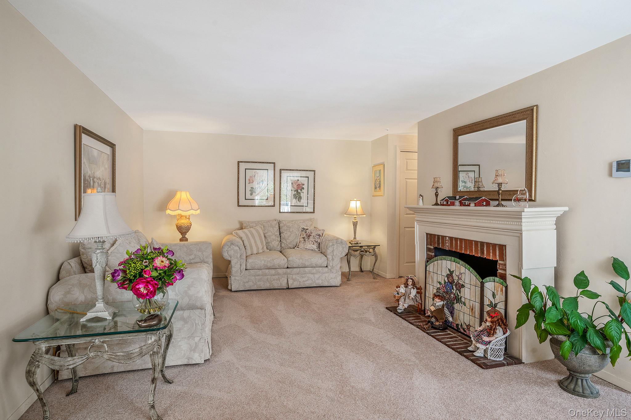 310 Birchwood Road Medford, NY 11763 - Photo 5 of 43 a living room with furniture and a fireplace