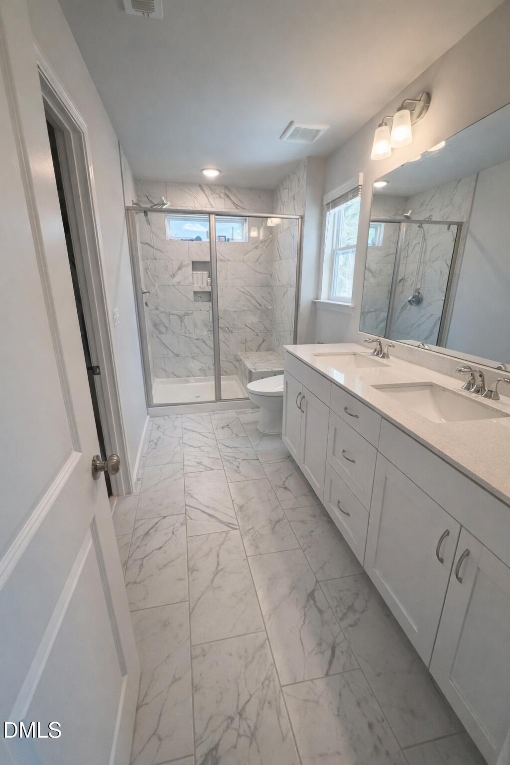 217 Beacon Hl Road Lillington, NC 27546 - Photo 13 of 24 a spacious bathroom with a granite countertop sink a mirror and a shower