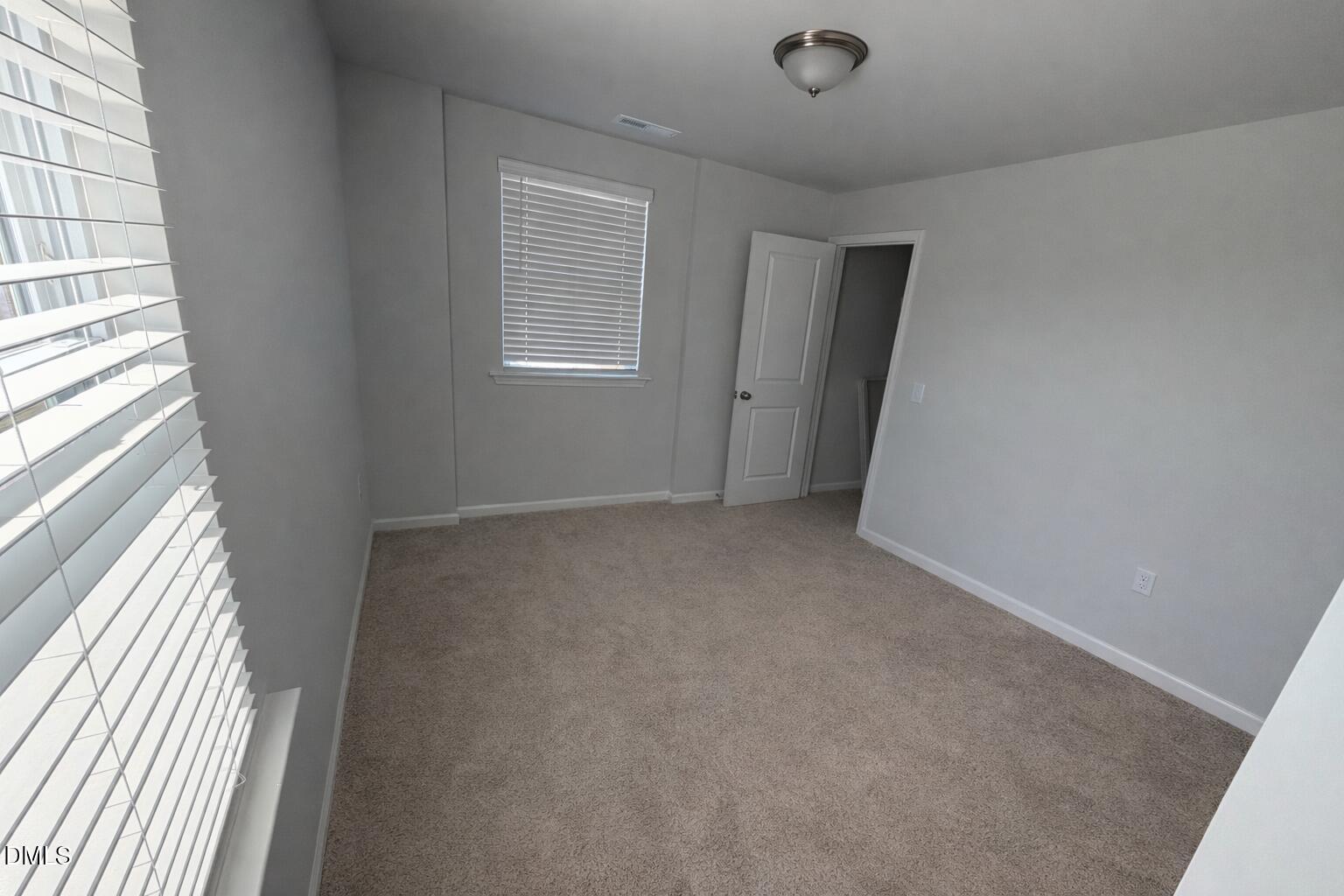 217 Beacon Hl Road Lillington, NC 27546 - Photo 14 of 24 an empty room with windows