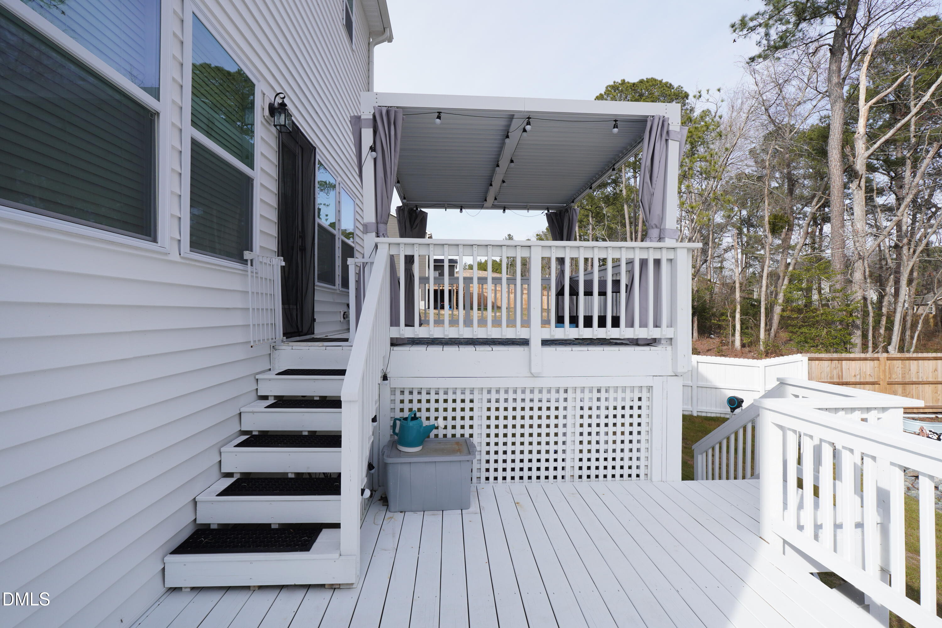 217 Beacon Hl Road Lillington, NC 27546 - Photo 19 of 24 a view of a deck with wooden floor and fence