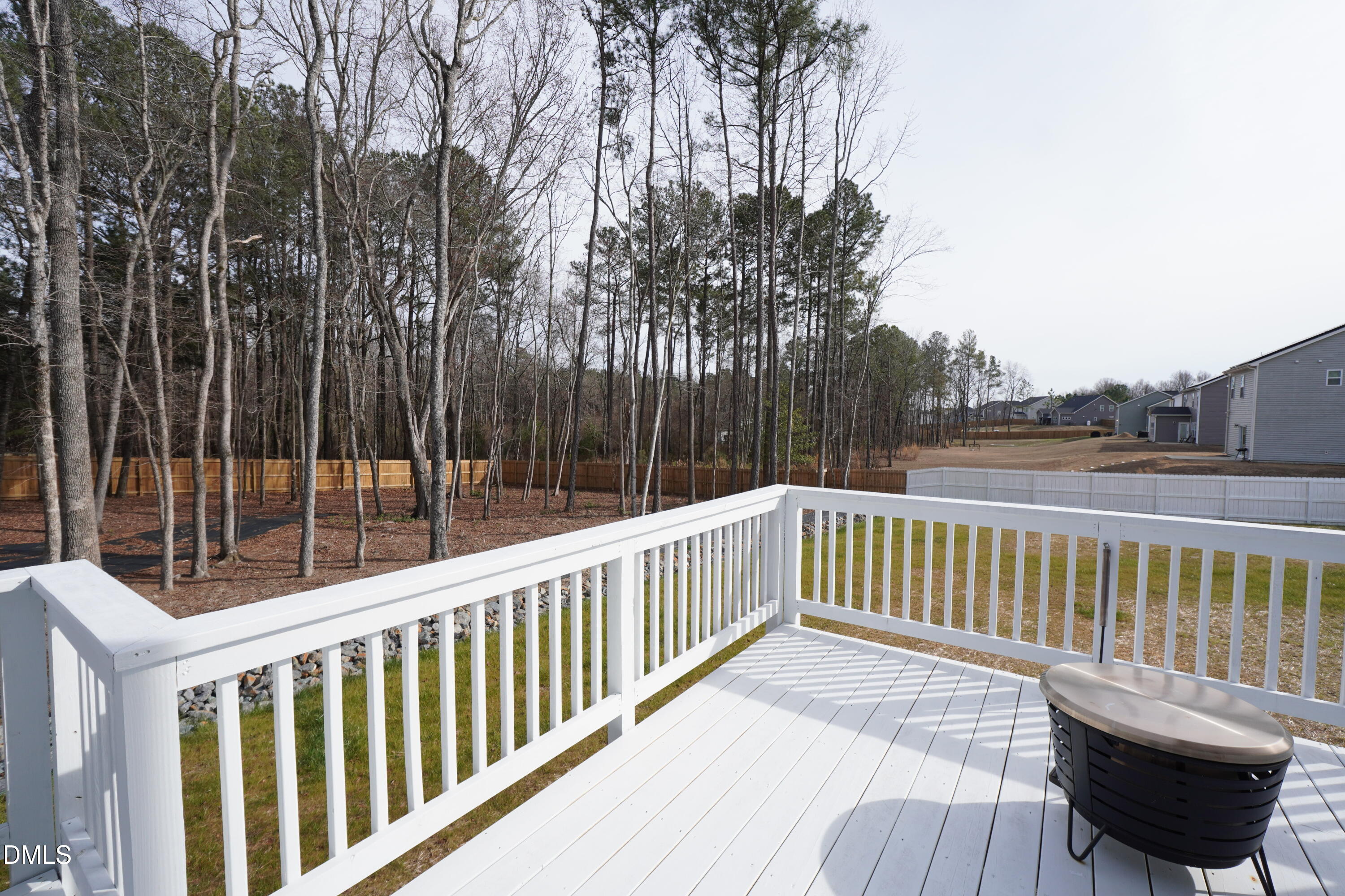 217 Beacon Hl Road Lillington, NC 27546 - Photo 21 of 24 a view of balcony with wooden floor and outdoor seating