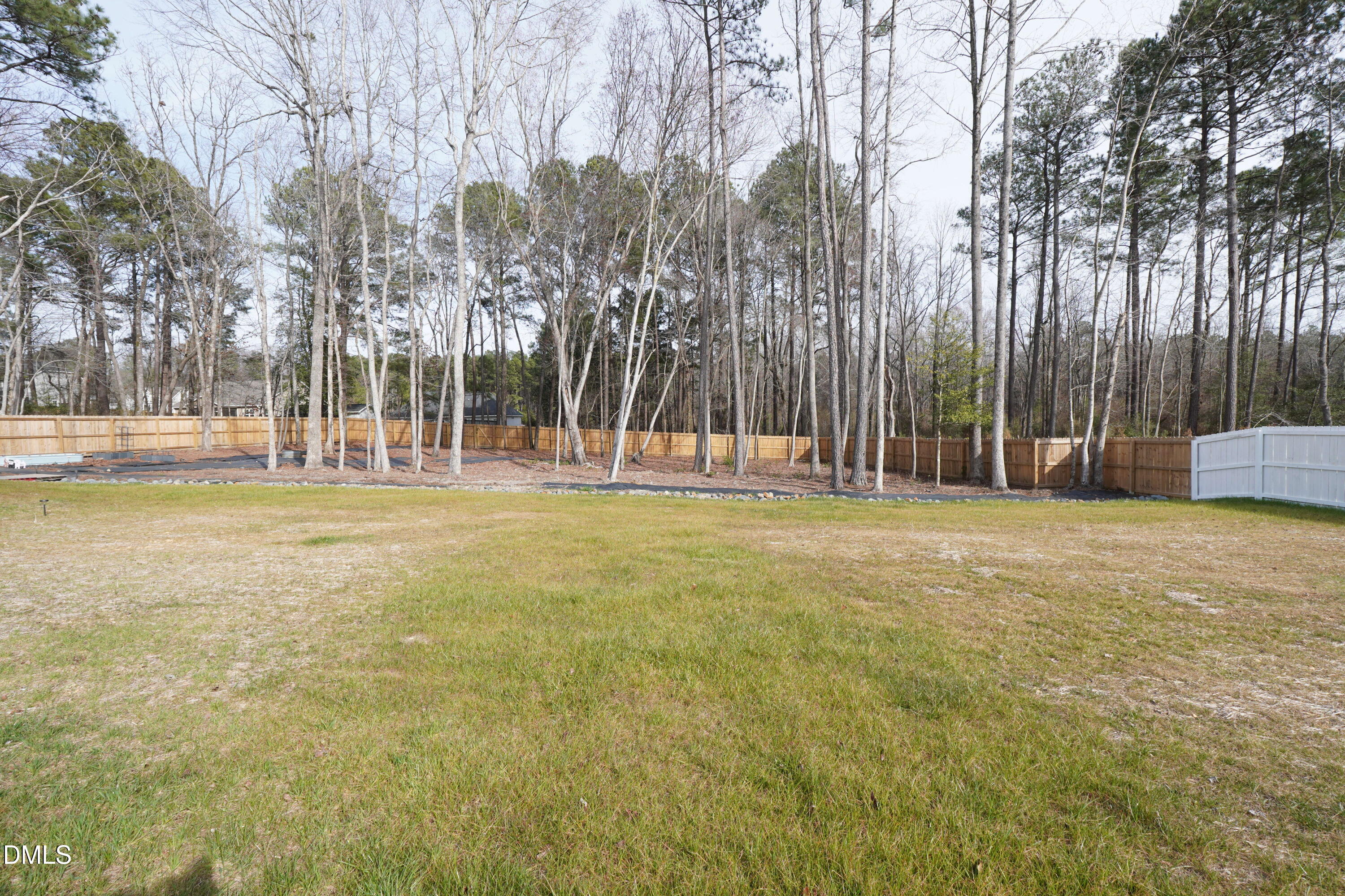 217 Beacon Hl Road Lillington, NC 27546 - Photo 23 of 24 a backyard of apartments with large trees
