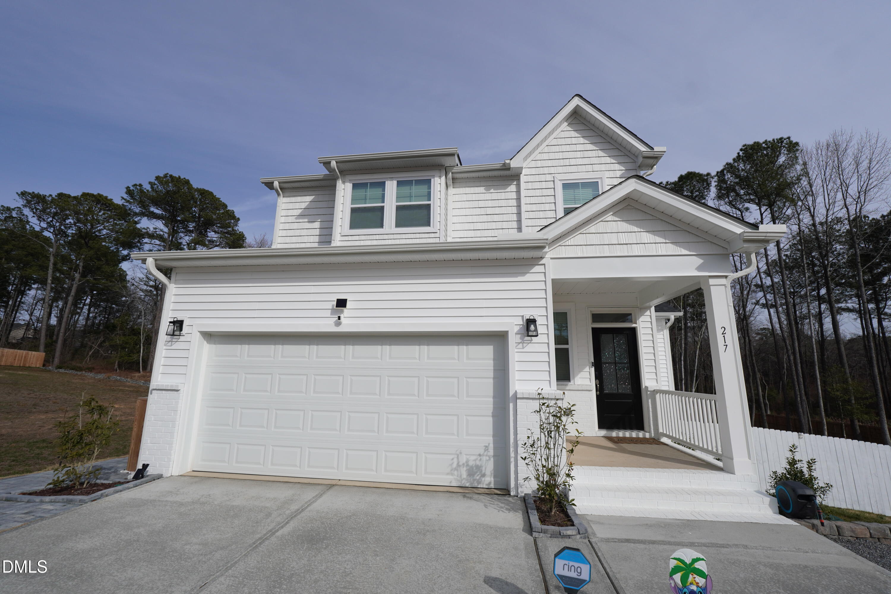 217 Beacon Hl Road Lillington, NC 27546 - Photo 3 of 24 a front view of a house with a garage