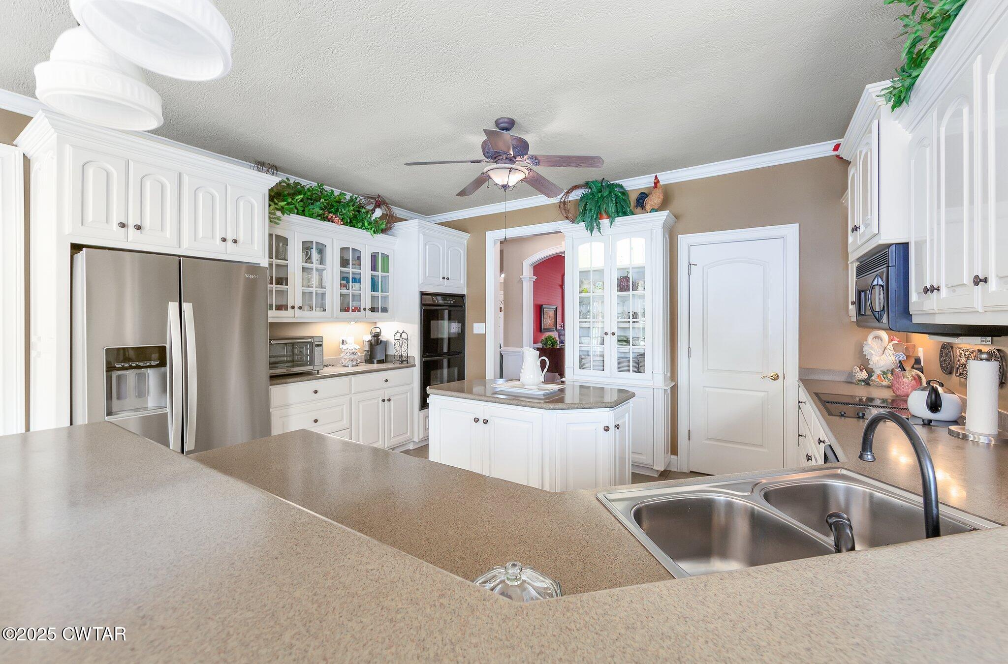 18 Admirals Pointe Jackson, TN 38305 - Photo 20 of 86 a kitchen with stainless steel appliances a refrigerator sink and cabinets