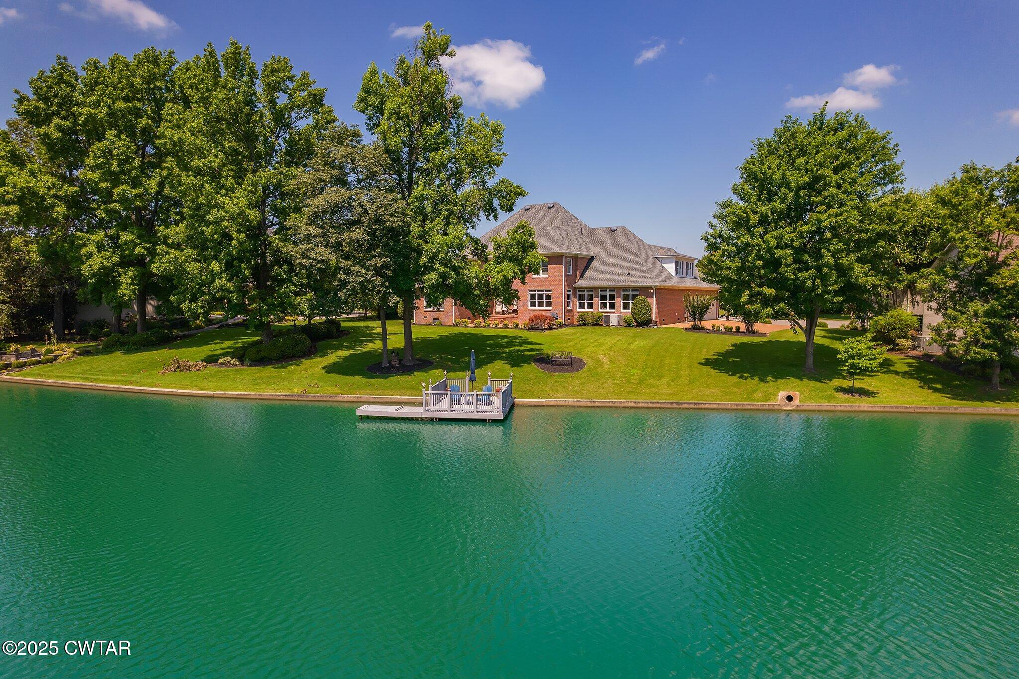 18 Admirals Pointe Jackson, TN 38305 - Photo 3 of 86 a view of a house with a yard