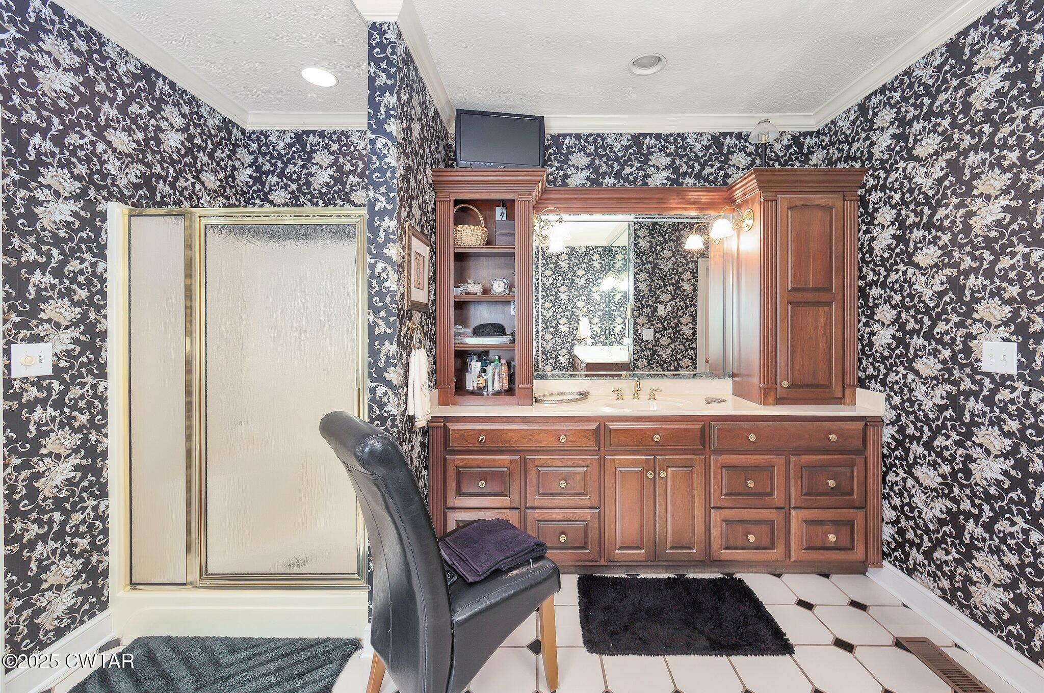 18 Admirals Pointe Jackson, TN 38305 - Photo 35 of 86 a spacious bathroom with a granite countertop sink a mirror and a shower