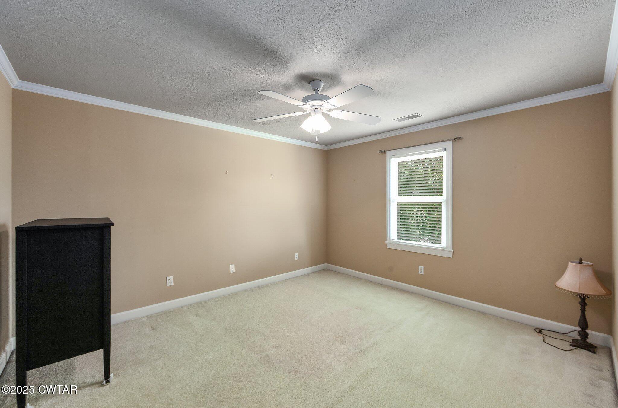 18 Admirals Pointe Jackson, TN 38305 - Photo 41 of 86 an empty room with a window and a fan