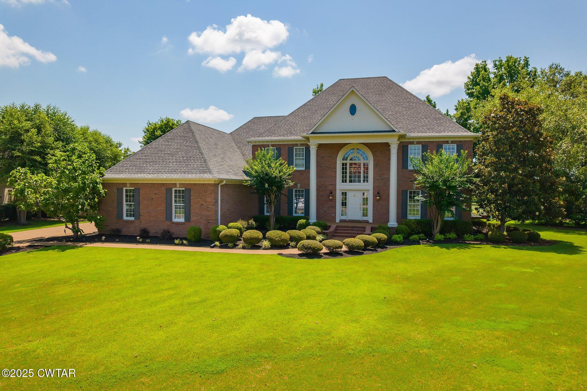 18 Admirals Pointe Jackson, TN 38305 - Photo 10 of 86 a front view of house with yard outdoor seating and barbeque oven