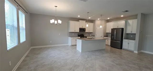 a kitchen with sink and window