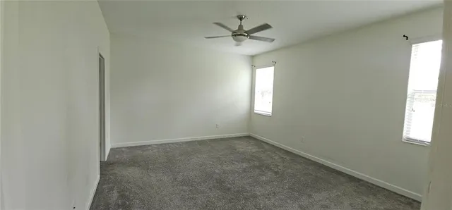 a bathroom with a granite countertop sink mirror and shower