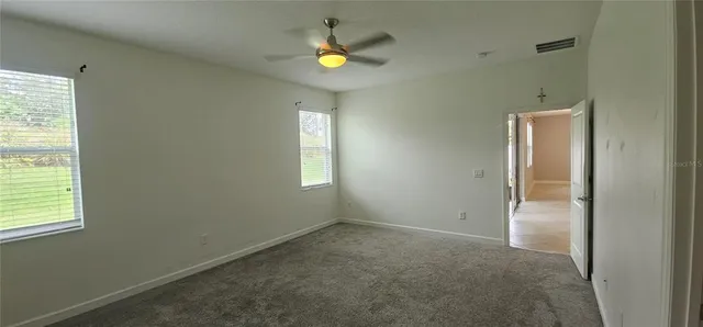 an empty room with windows