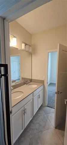 a bathroom with a granite countertop sink toilet a shower and a mirror