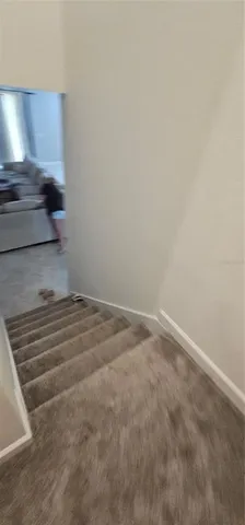 a bedroom with bed and window