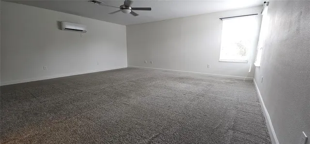 a bathroom with a sink a toilet a large mirror and shower