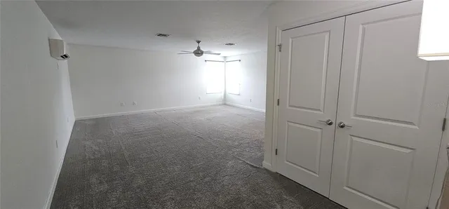 a bathroom with a toilet and a shower curtain