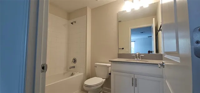 a bedroom with bed and a window