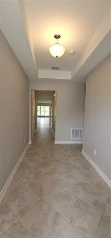 a bathroom with a shower and mirror