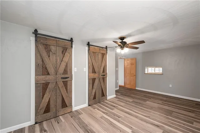 a view of room with window and ceiling fan