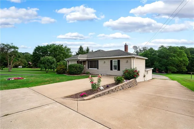 a front view of a house with yard