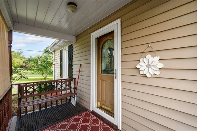 a view of a porch with wooden floor