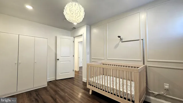 a view of a hallway with a chandelier