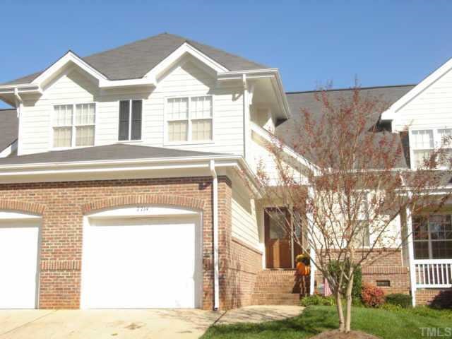 7714 Astoria Place Raleigh, NC 27612 - Photo 1 of 1 a front view of a house with a garden