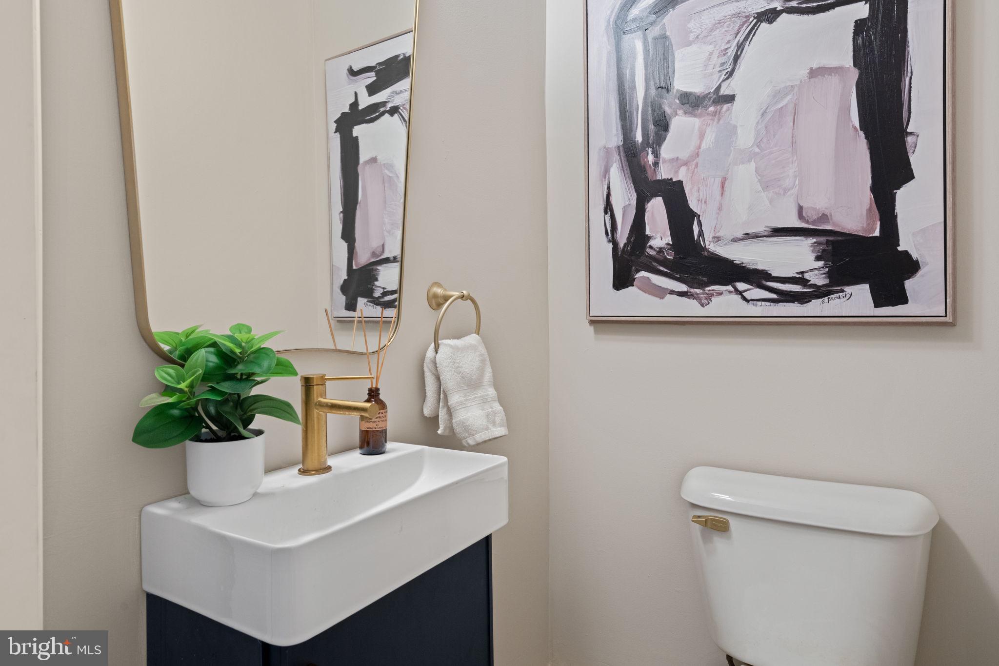 4092 Pechin Street Philadelphia, PA 19128 - Photo 11 of 28 a bathroom with a toilet sink and mirror