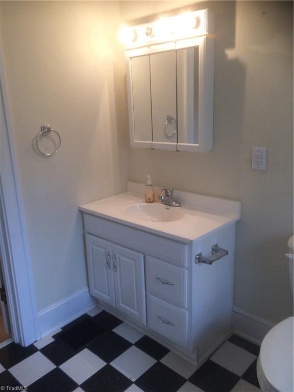 915 Old Winston Road High Point, NC 27265 - Photo 8 of 22 Updated vanity and chair height toilet in Master bath.