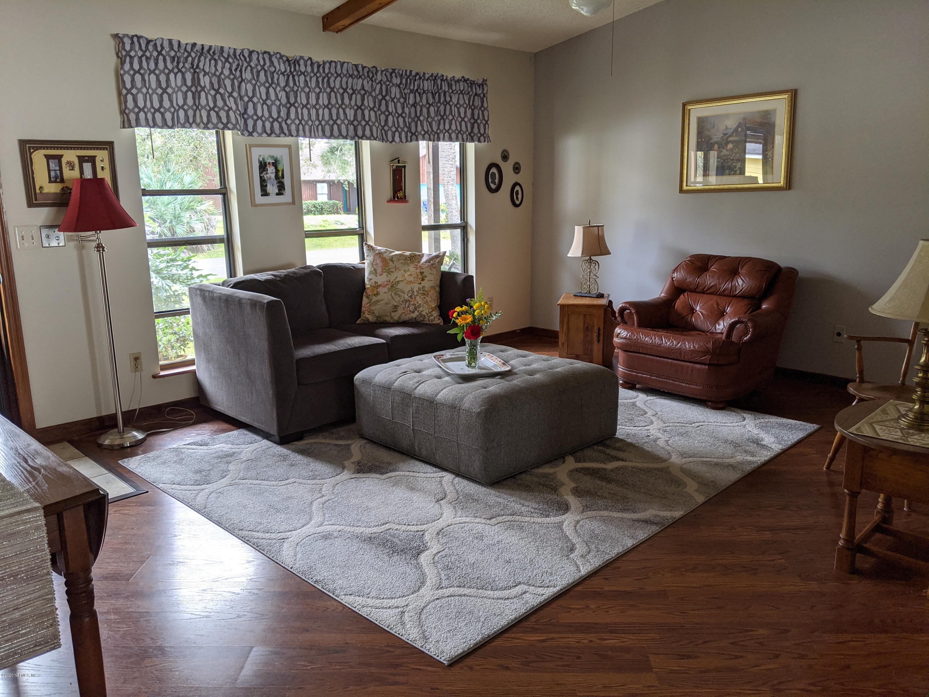 106 Jasmine Road St. Augustine, FL 32086 - Photo 3 of 11 a living room with furniture and a large window