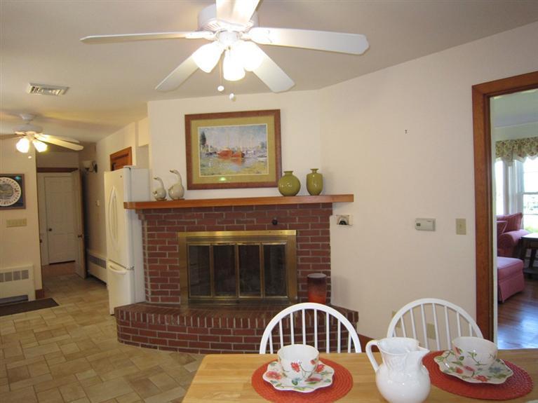 22 Samoset Road Orleans, MA 02653 - Photo 18 of 31 a living room with furniture and a fireplace