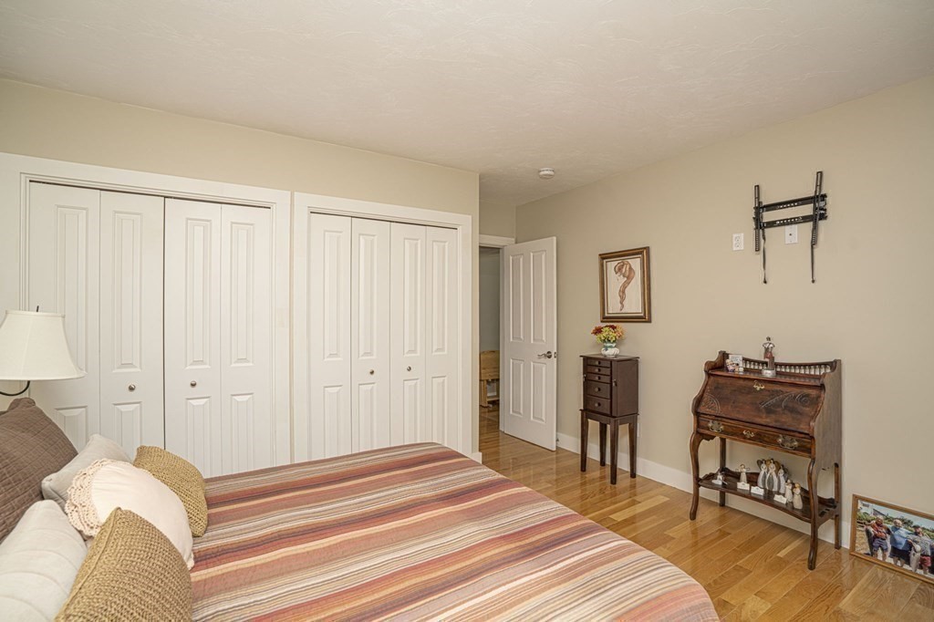 52 Upland Drive Middleboro, MA 02346 - Photo 22 of 40 a bedroom with a bed and a table in it