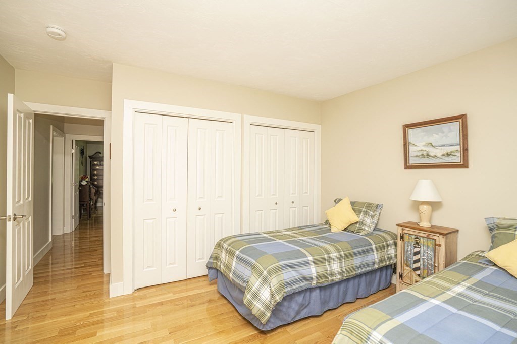 52 Upland Drive Middleboro, MA 02346 - Photo 25 of 40 a bedroom with a bed and a painting on the wall