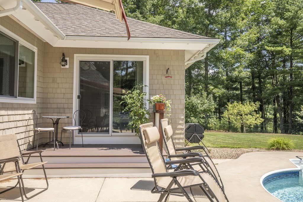 52 Upland Drive Middleboro, MA 02346 - Photo 29 of 40 a view of a patio with table and chairs and potted plants