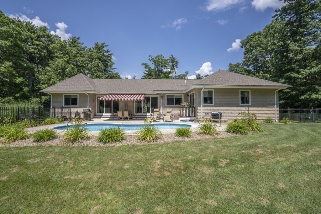 52 Upland Drive Middleboro, MA 02346 - Photo 37 of 40 a front view of a house with swimming pool and green space