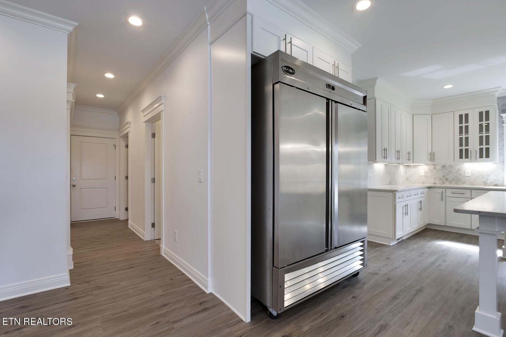 405 Beard Valley Road Maynardville, TN 37807 - Photo 15 of 60 a kitchen with stainless steel appliances a refrigerator and a view of living room