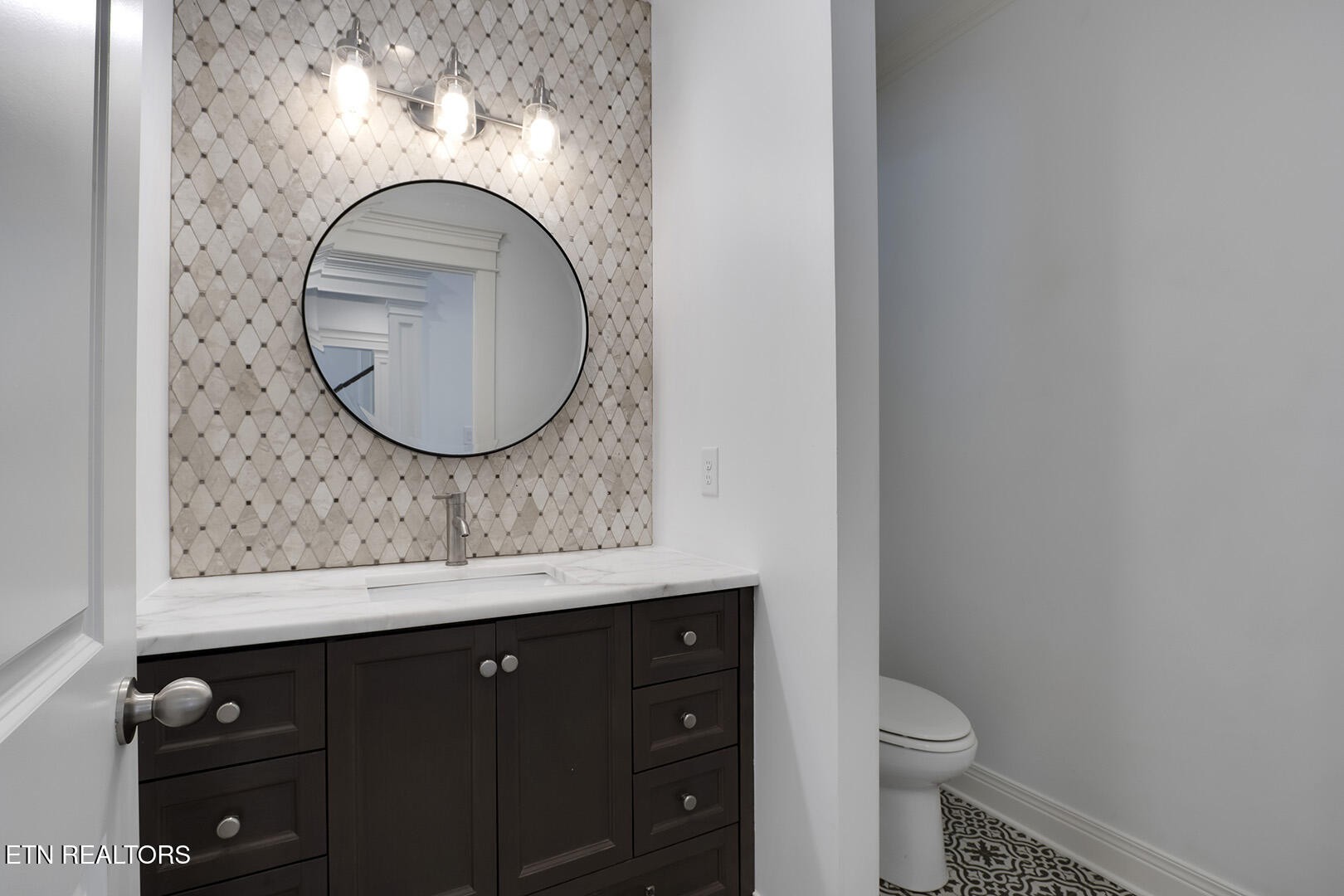 405 Beard Valley Road Maynardville, TN 37807 - Photo 16 of 60 a bathroom with a toilet a sink and a mirror