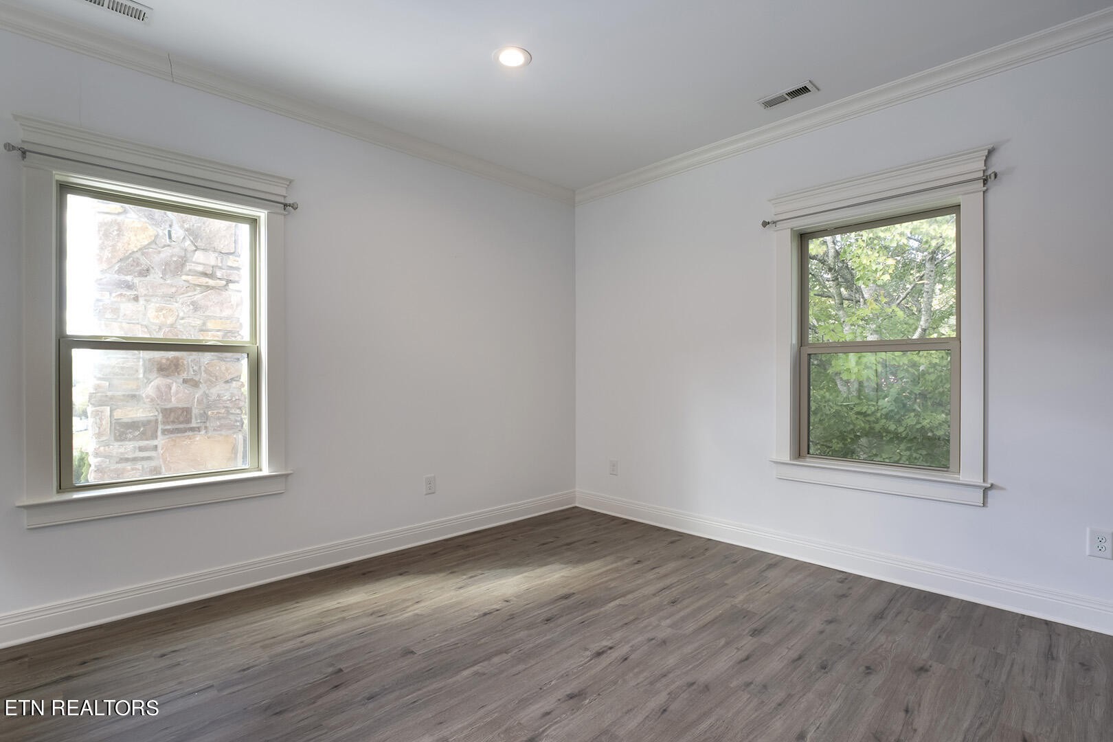 405 Beard Valley Road Maynardville, TN 37807 - Photo 27 of 60 an empty room with wooden floor and windows
