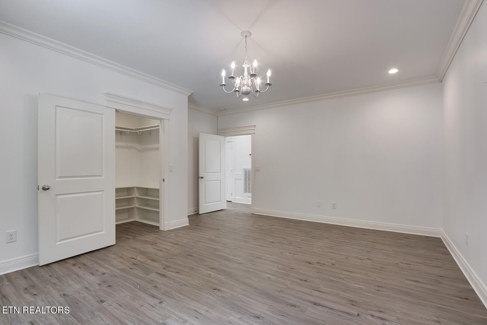405 Beard Valley Road Maynardville, TN 37807 - Photo 32 of 60 a view of an empty room with wooden floor and windows