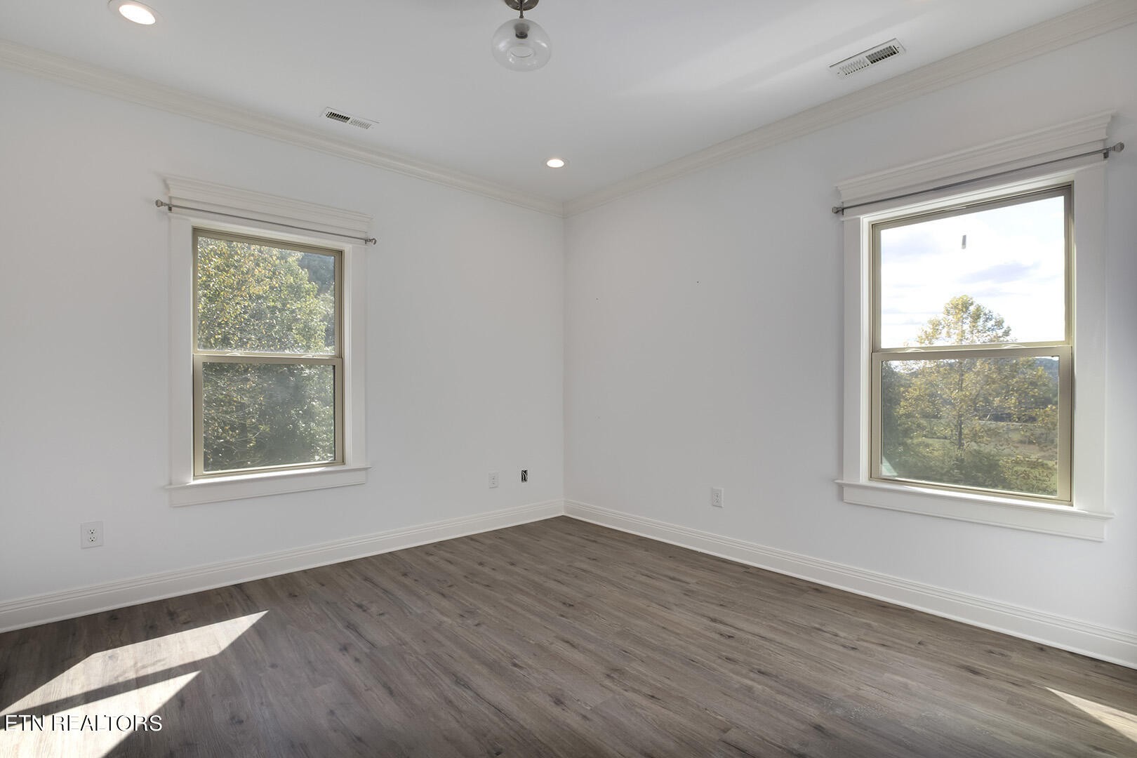 405 Beard Valley Road Maynardville, TN 37807 - Photo 38 of 60 an empty room with wooden floor and windows