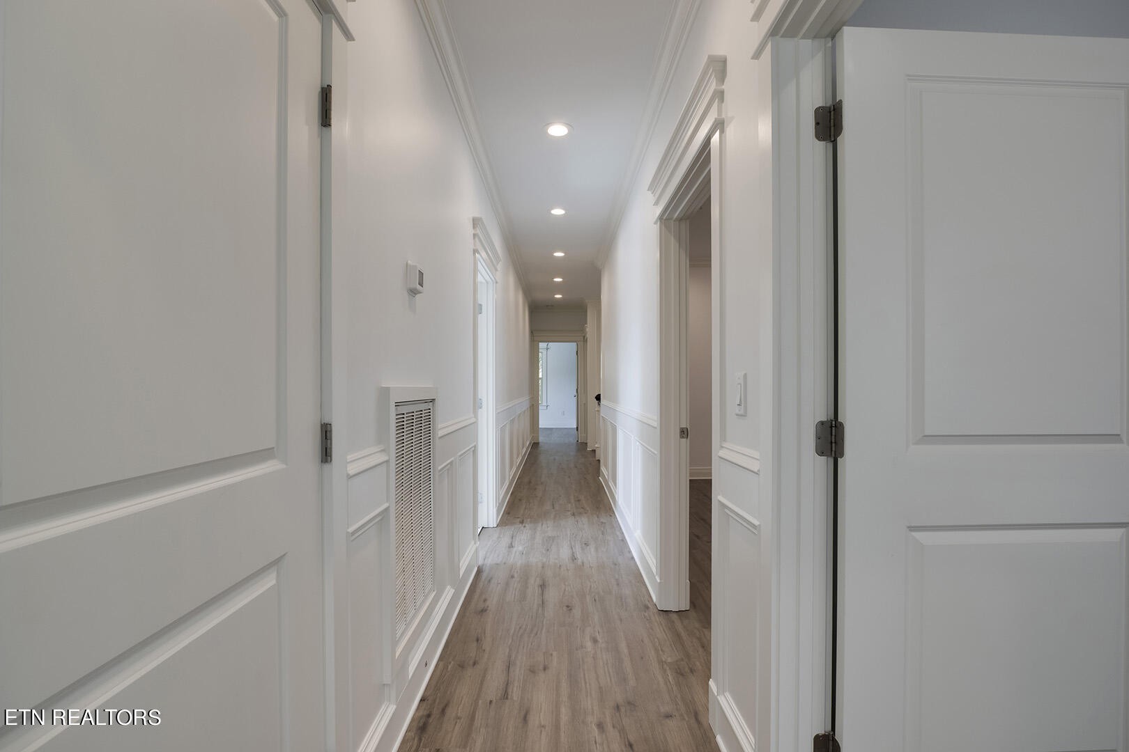 405 Beard Valley Road Maynardville, TN 37807 - Photo 40 of 60 a view of a hallway with wooden floor and a bathroom