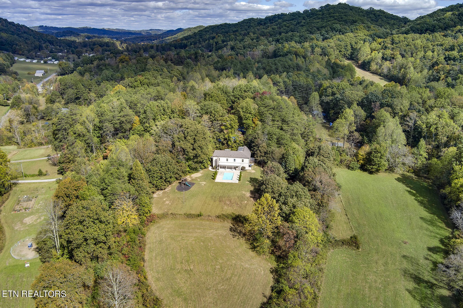 405 Beard Valley Road Maynardville, TN 37807 - Photo 57 of 60 a view of a lake with a mountain in the background