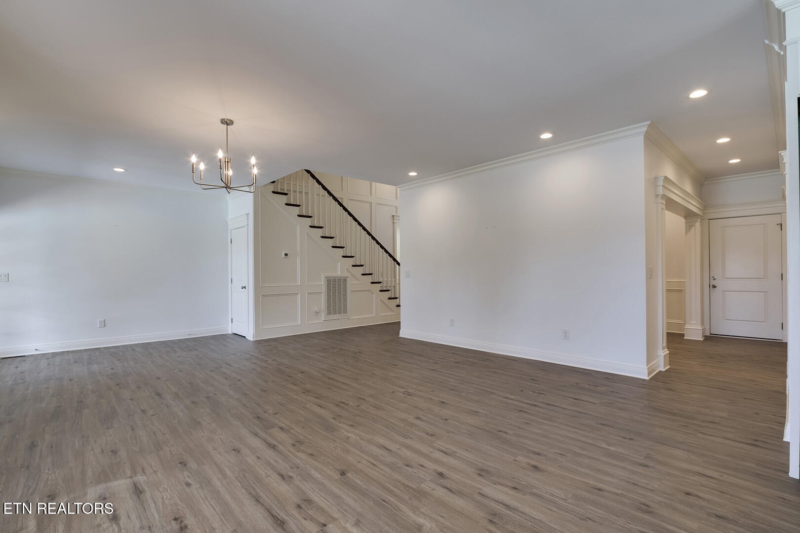 405 Beard Valley Road Maynardville, TN 37807 - Photo 7 of 60 an empty room with wooden floor chandelier and entryway