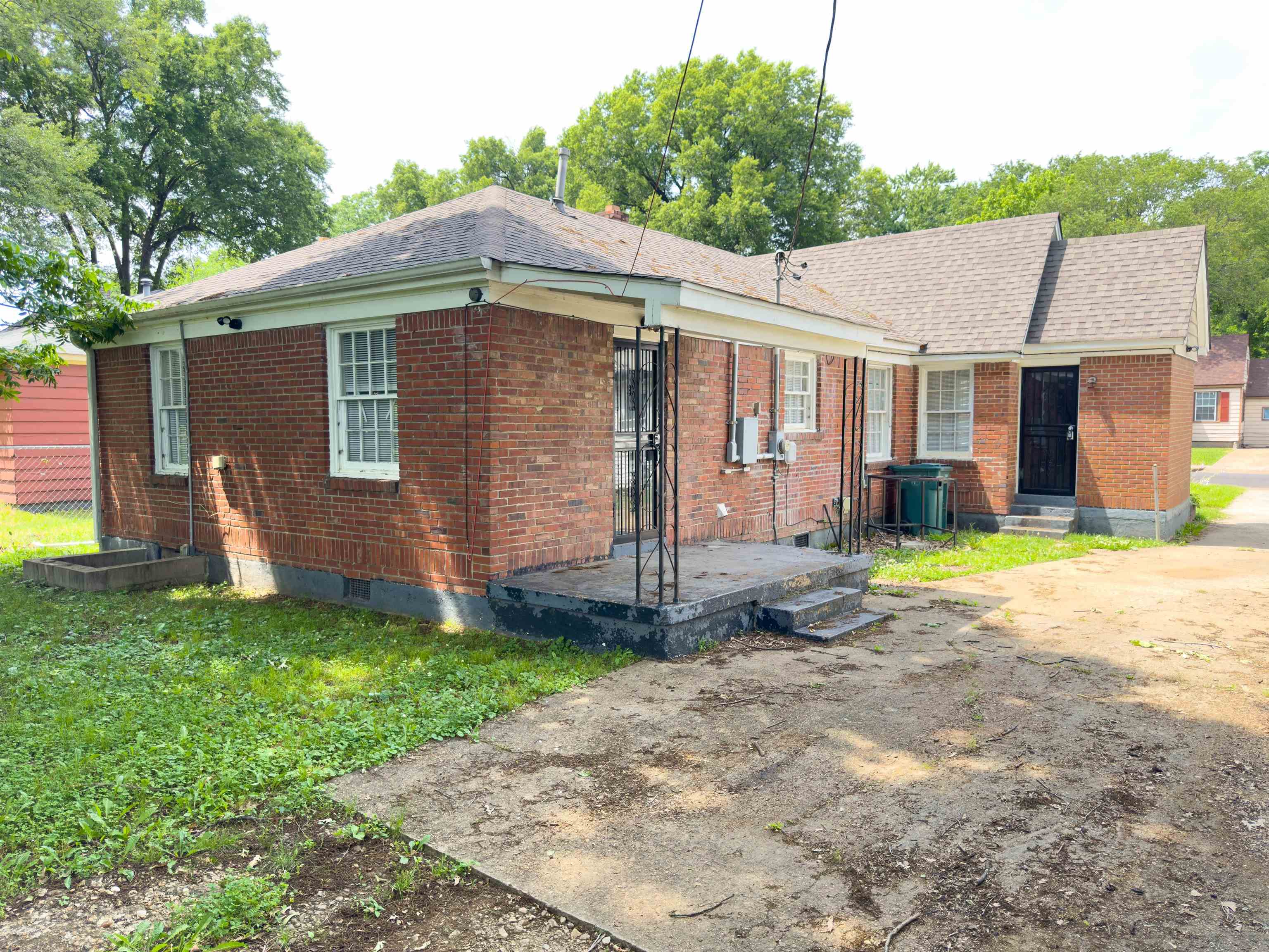 2703 Fizer Road Memphis, TN 38114 - Photo 6 of 19 Rear view of property featuring brick siding and a shingled roof