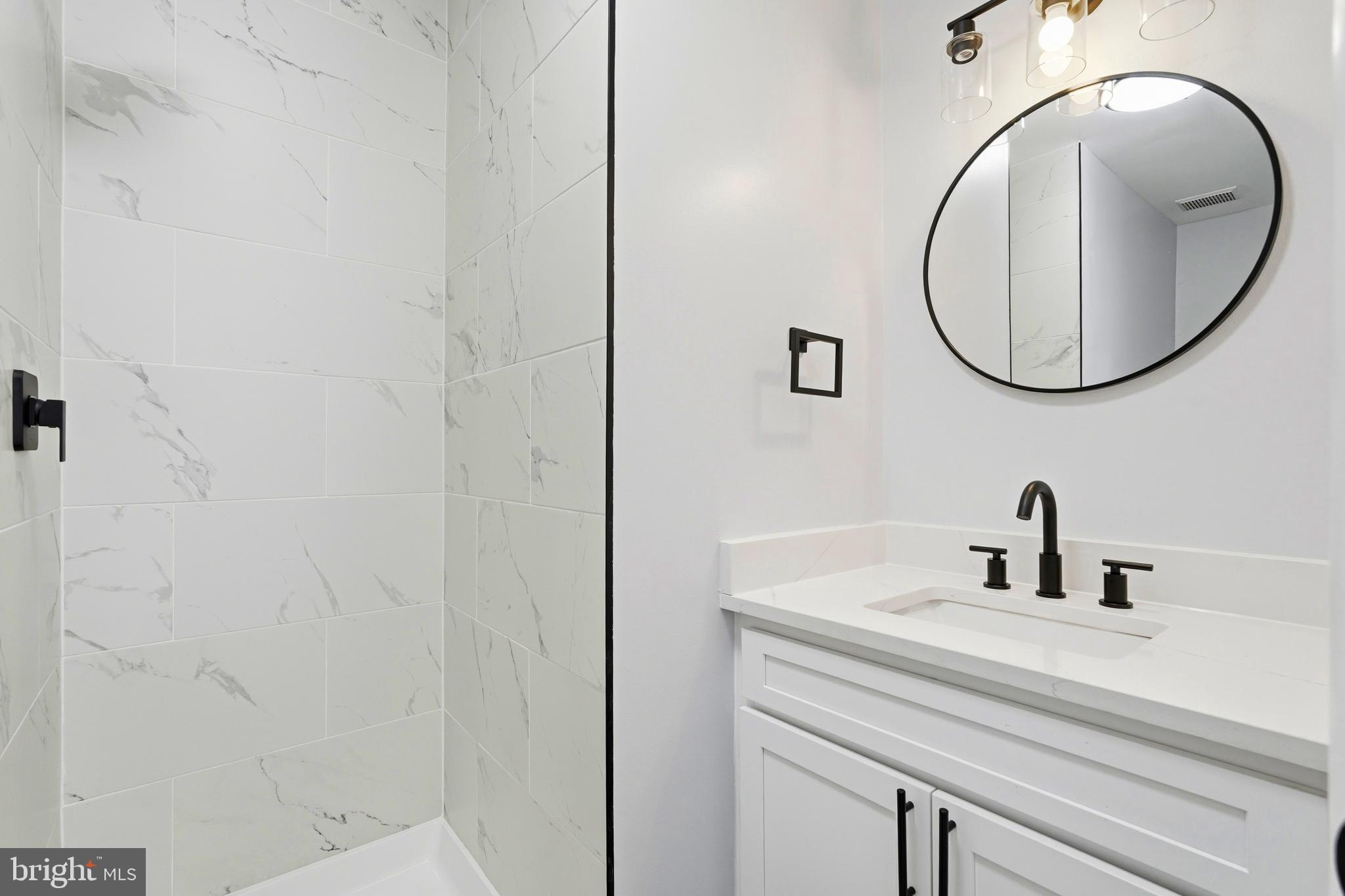 3682 Masthead Trail Triangle, VA 22172 - Photo 44 of 53 a bathroom with a sink and a mirror