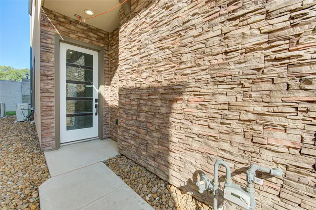 a view of a pathway door with wooden floor
