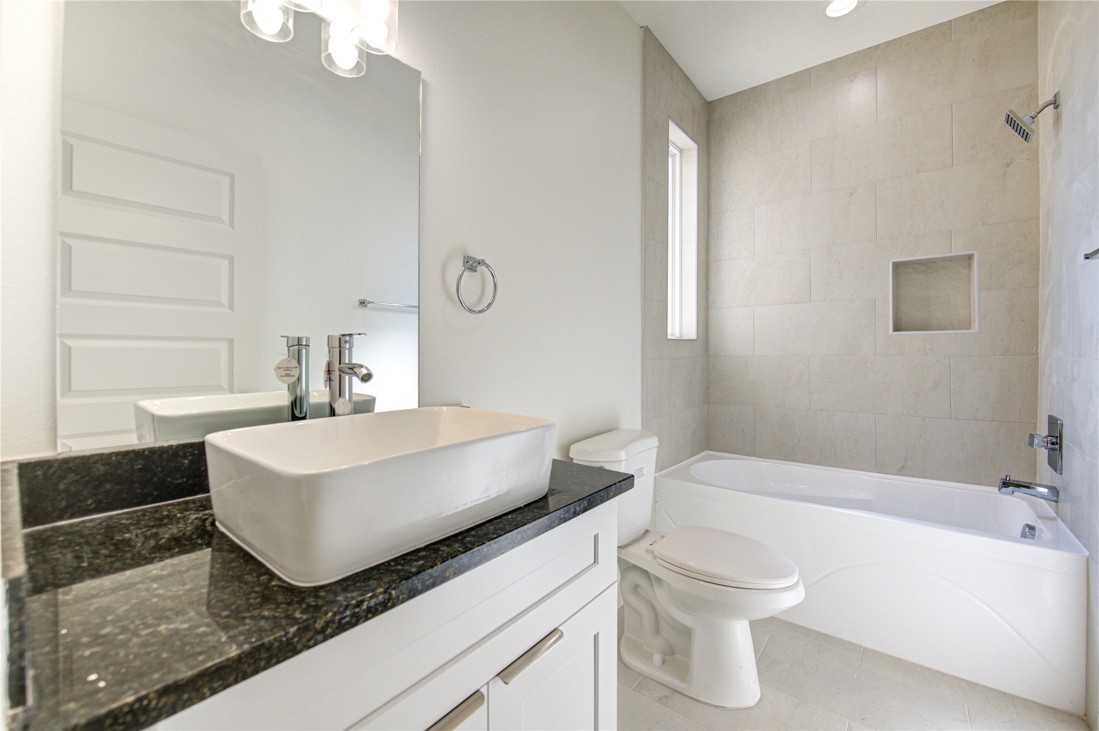 2903 El Fenice Lane Houston, TX 77057 - Photo 29 of 42 a bathroom with a sink a toilet and a bathtub