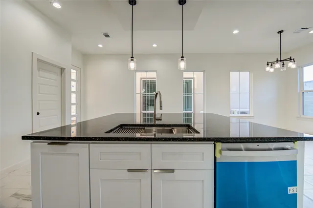 a kitchen with a counter space and a window