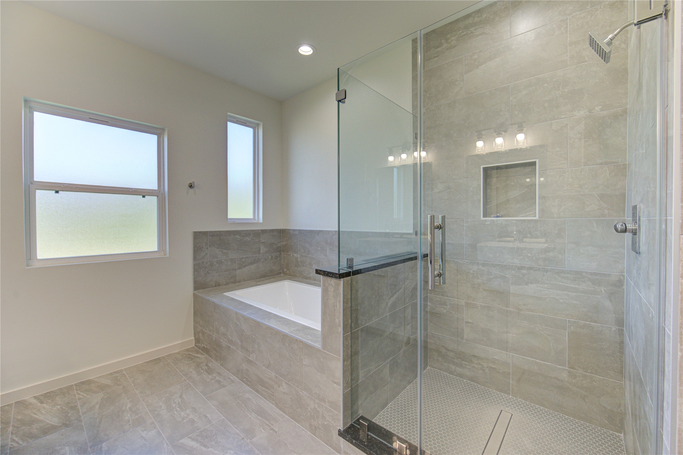 2903 El Fenice Lane Houston, TX 77057 - Photo 10 of 42 a bathroom with a shower and a mirror