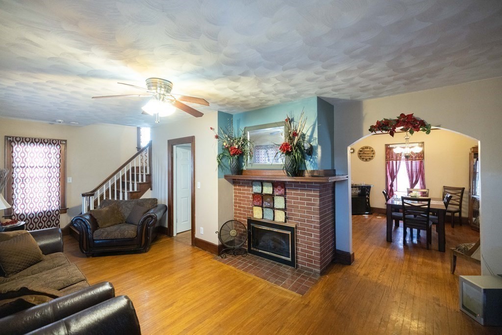 61 Dwight Road Springfield, MA 01108 - Photo 12 of 34 a living room with furniture and a dining table